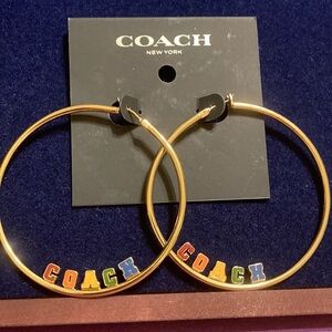 NWT Gold tone large hoop lever back earrings w/multicolored block letter  logo